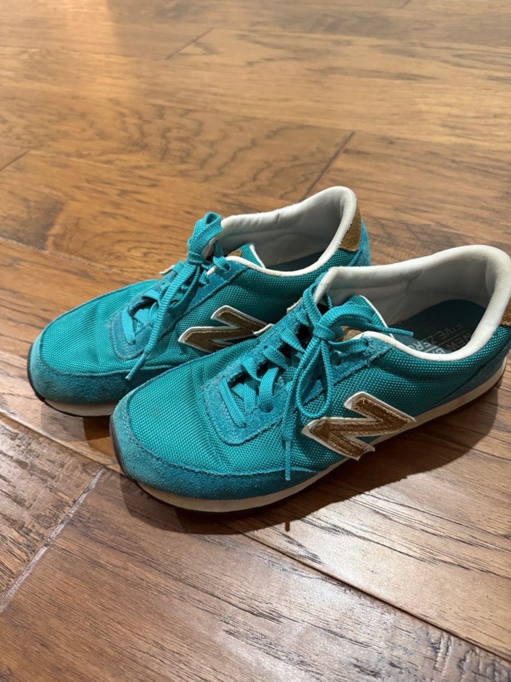 New Balance Teal Sneakers with Gold Accents